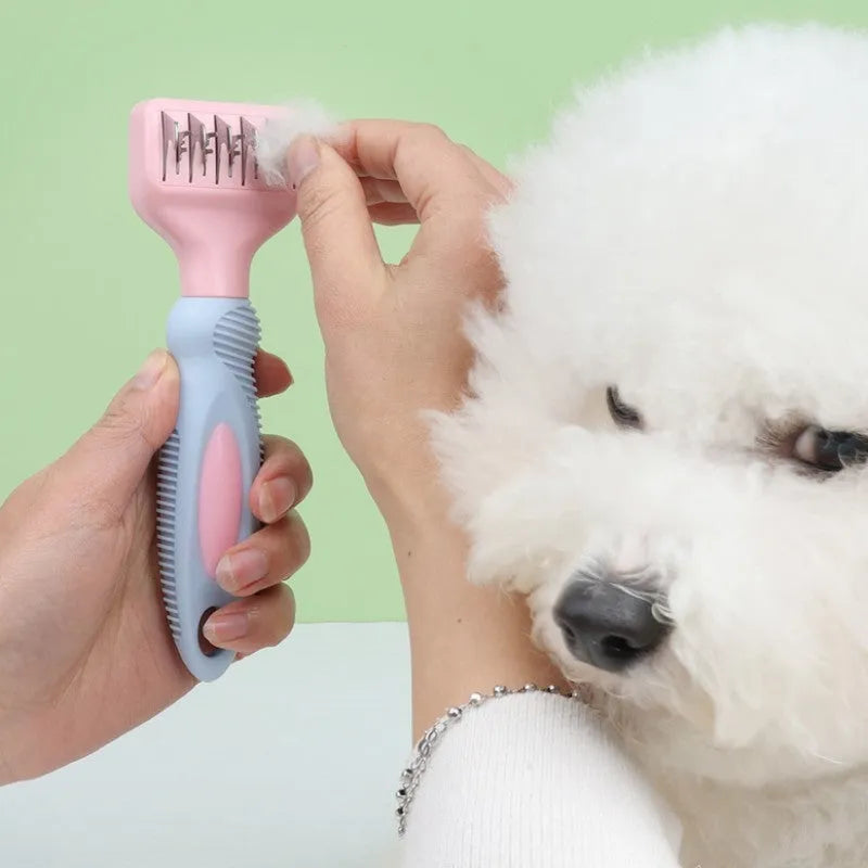 Pink dog comb with stainless steel blade and massage nodules for pet grooming.