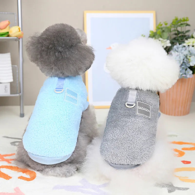 A blue coral fleece jacket for pets with five multi-coloured pull rings for adjustment on the front.