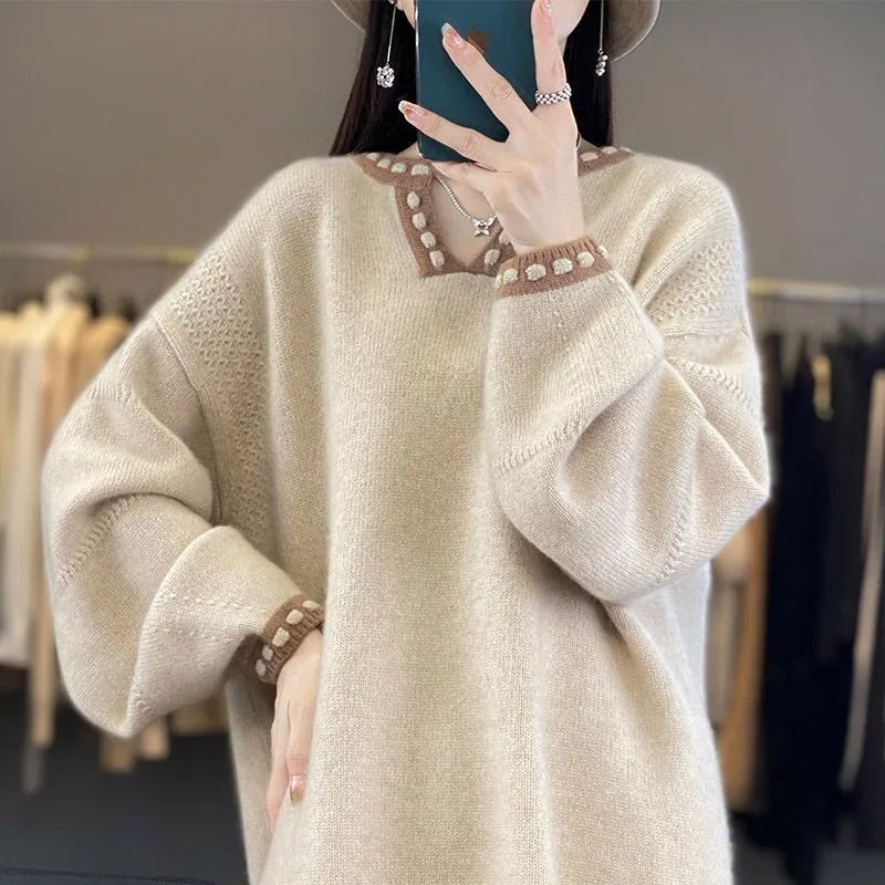 Women's camel coloured V-neck long sleeve viscose sweater on a hanger.