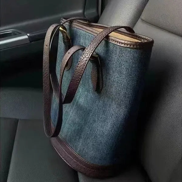 Denim patchwork one-shoulder bucket handbag showing 23x27x16cm dimensions and retro design