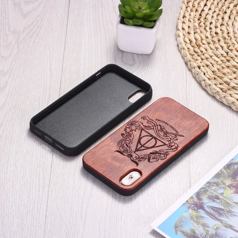 Wooden mobile phone case with laser-carved wood back and black TPU bumper frame for iPhone.