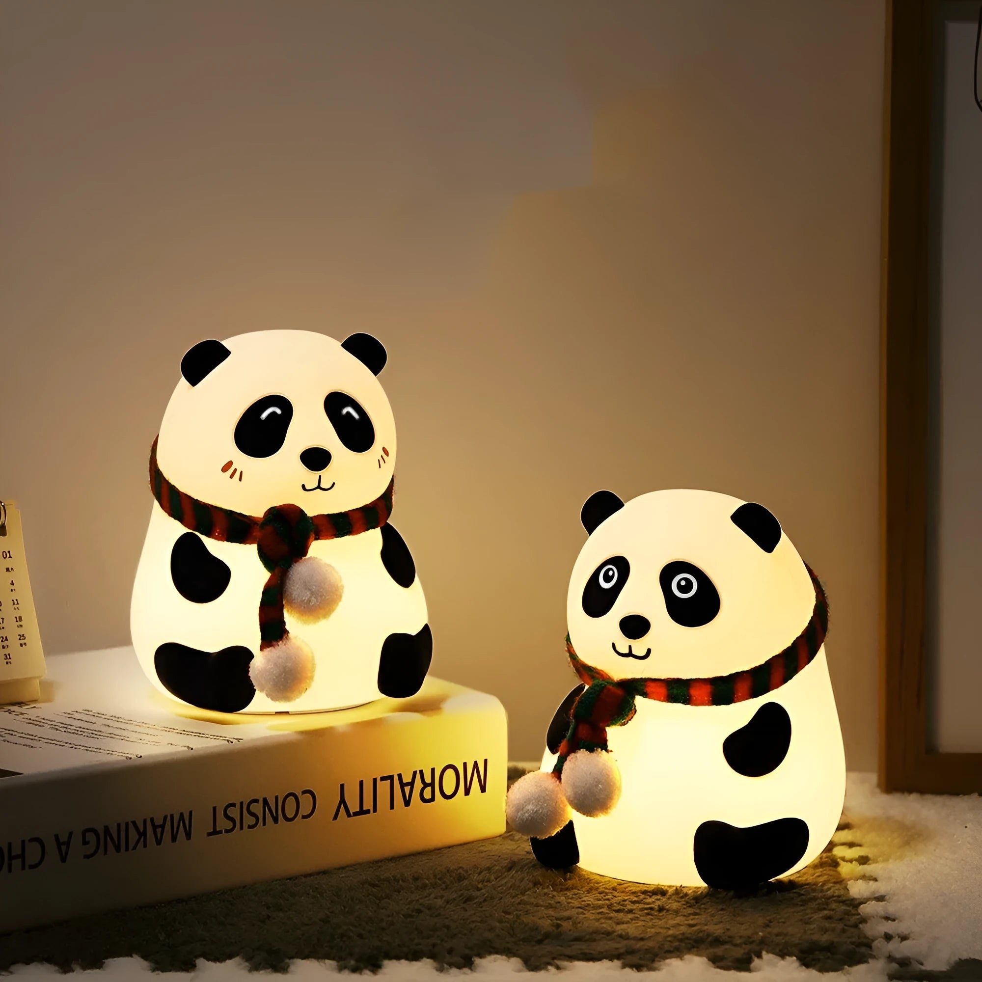 Panda-shaped silicone night light with USB cable on a table