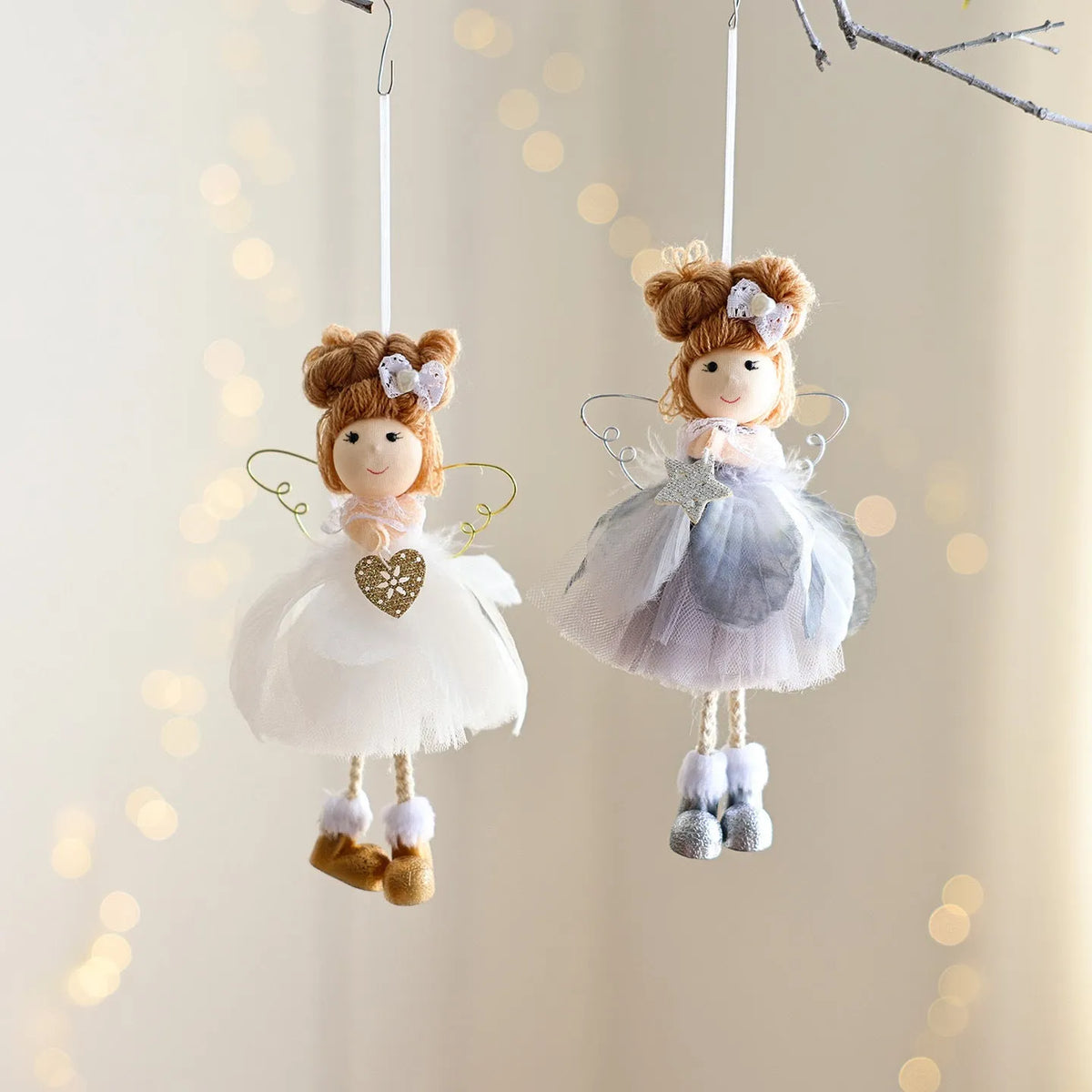 White Christmas tree hanging ornament with mesh angel girl design, snowflake styling, and metal, plastic, and cloth construction.