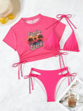 Women's three-piece bikini swimsuit set in black, shown with short sleeves and matching pants.