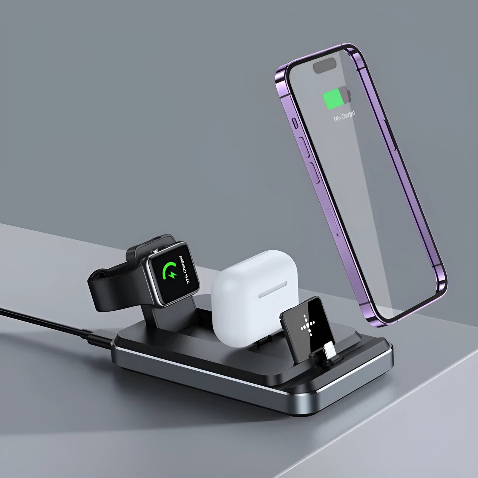 Flat folding three in one wireless charger in black with phone, watch, and headphones placed on charging zones