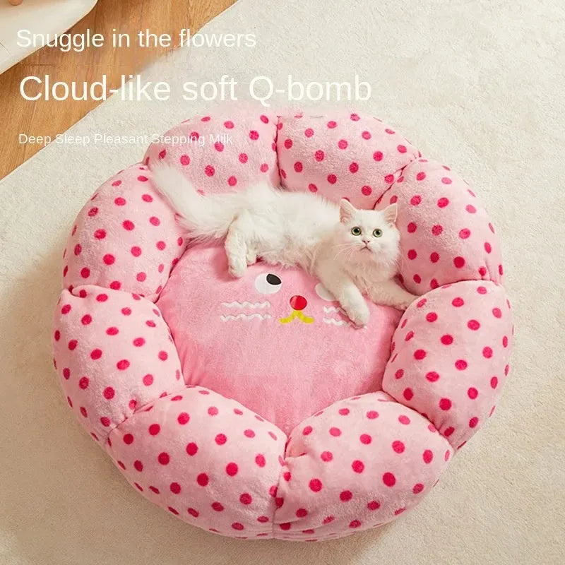 Pink dotted fabric cat bed shown in two circular sizes: 45cm and 65cm diameter.