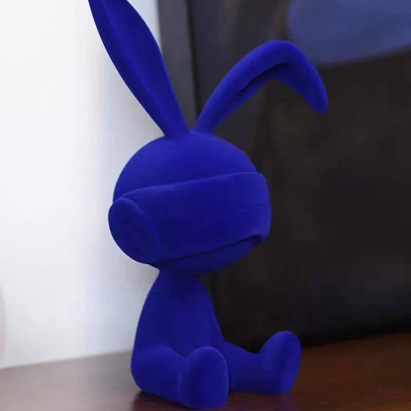 Suede blindfold rabbit resin table ornament in green, blue, or red colour options.