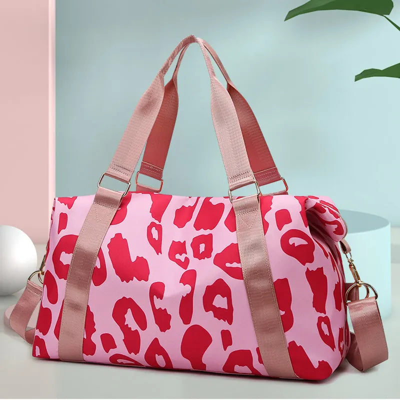 Women's large travel duffel bag with cow pattern, black, showing zippered main compartment and soft handle