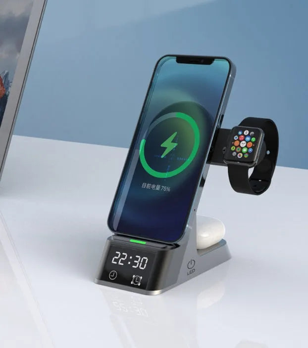 Black multifunctional alarm clock with digital display and wireless charging pad for phone, watch, and earbuds.