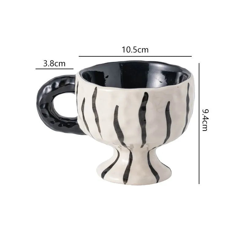 Hand-pinched irregular shaped ceramic mug in solid colour with 250ml capacity