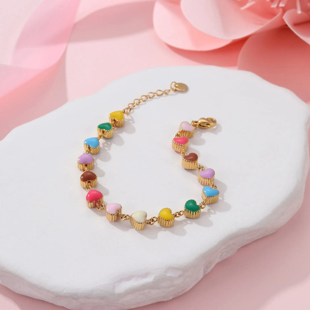 Women's titanium steel bracelet with heart-shaped charm in gold or steel electroplated finish