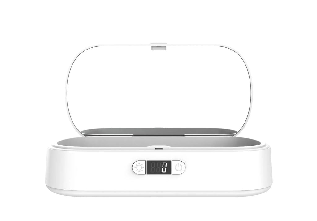 White ABS plastic wireless UV steriliser box with phone inside, showing charging indicator.