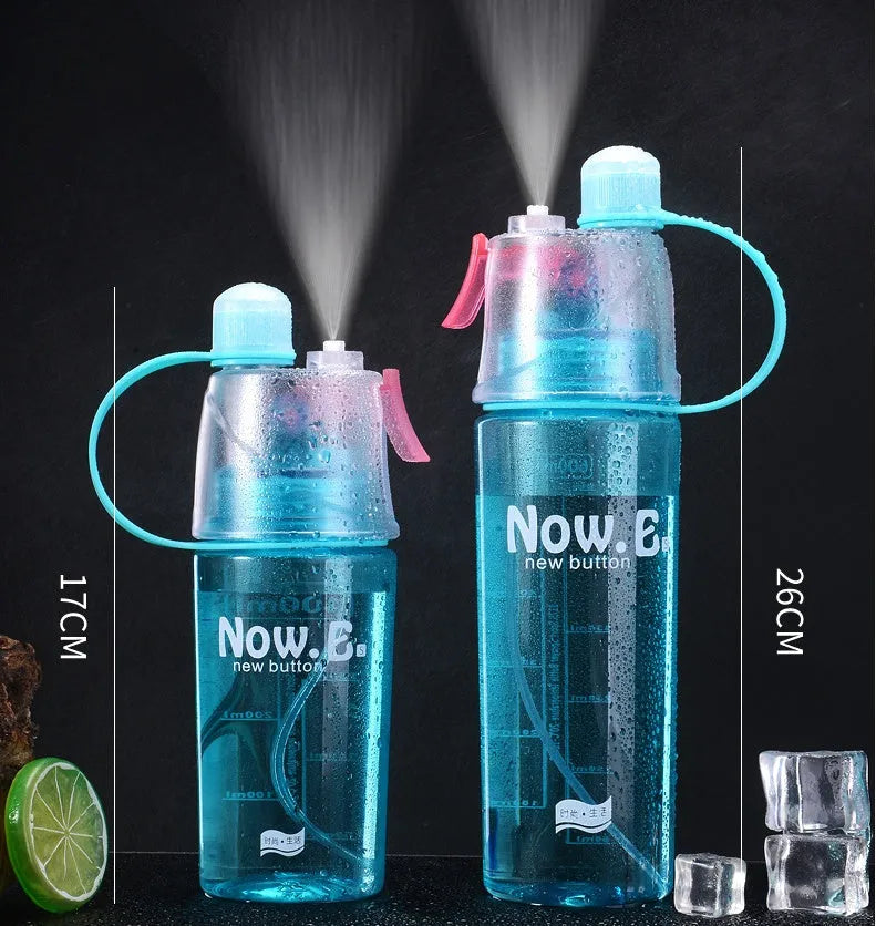 Portable mist spray sports water bottle with transparent body, handle, and press-to-spray mouth