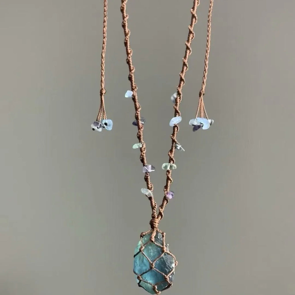 Artificial crystal rough labradorite-style pendant necklace with O-link chain on display