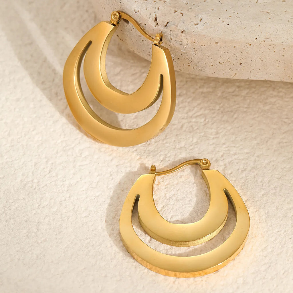 Metallic French geometric earrings with gold plating on stainless steel, featuring round ring elements