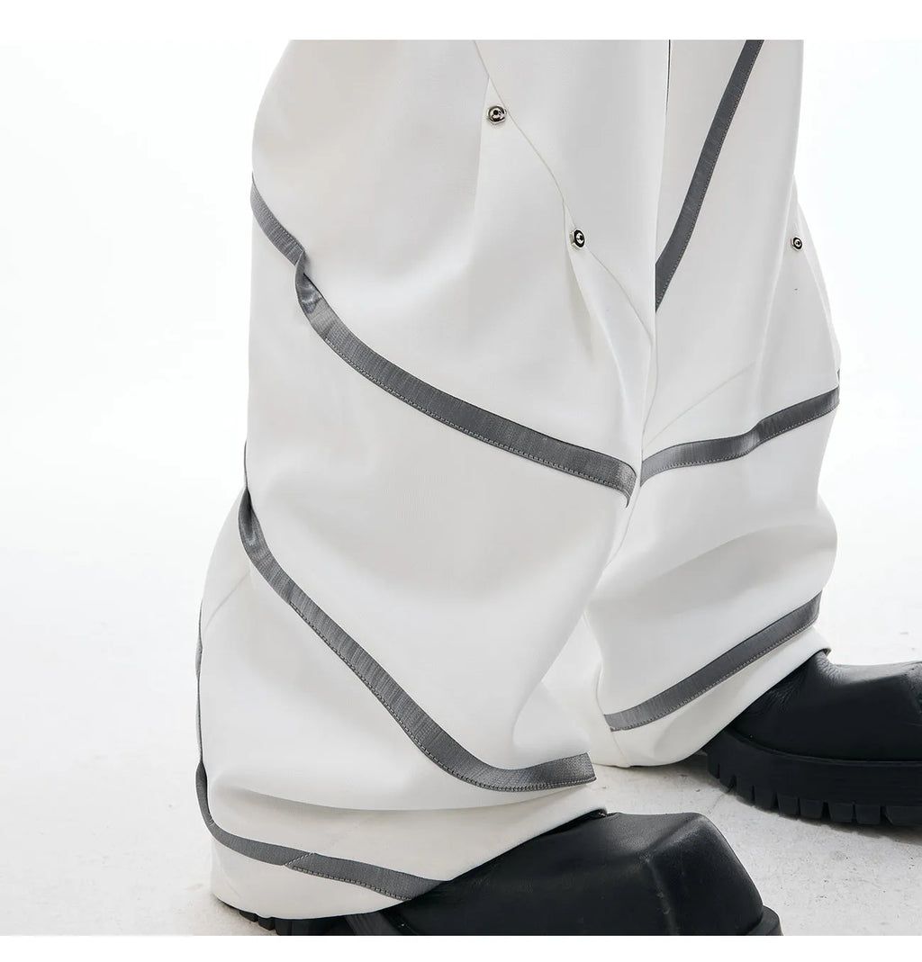 Men's polyester trousers with three-dimensional cutting and metal striped rivet pleats in black or white colours