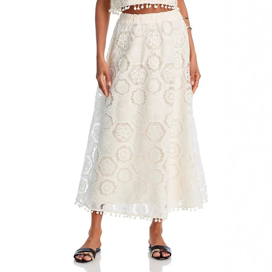 White women's retro style suit set with sleeveless top and embroidered long skirt