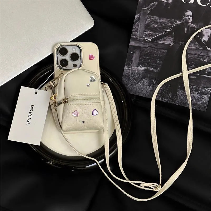 Crossbody wallet phone case for Apple iPhone with removable shoulder strap in antique white finish.