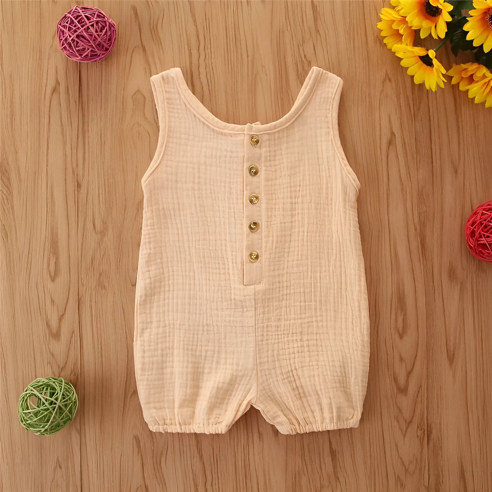 Cotton and linen sleeveless baby romper in solid colour, summer pullover style for girls.