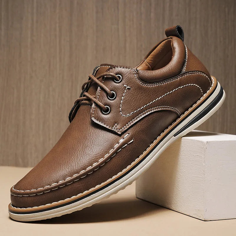 Men's black genuine leather casual lace-up shoes with round toe and low heel on a rubber sole