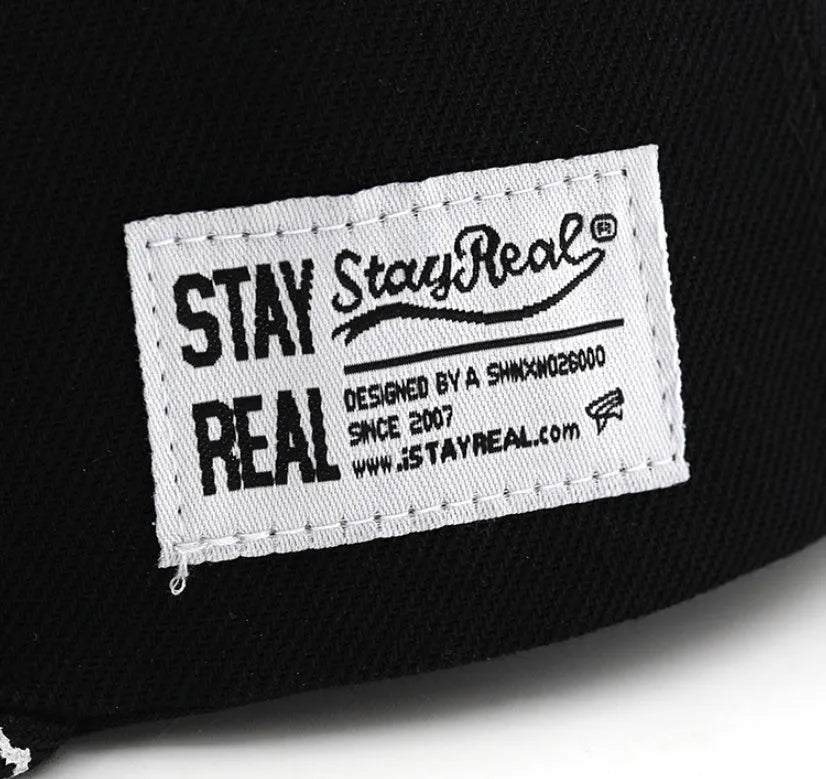 Cotton baseball cap with embroidered letters in black and white colour options