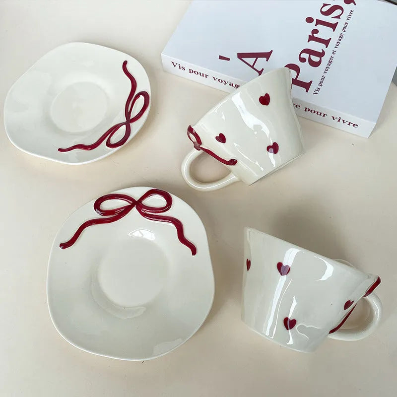 Hand painted white porcelain coffee cup with cherry design and matching coaster