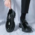 Men's glossy black platform loafers with a low hidden heel for summer wear.