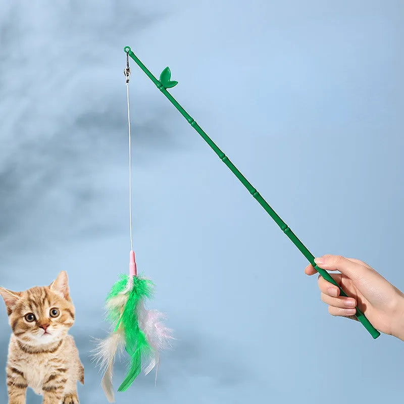 Green interactive cat feather wand toy with bells and feathers for indoor play and training