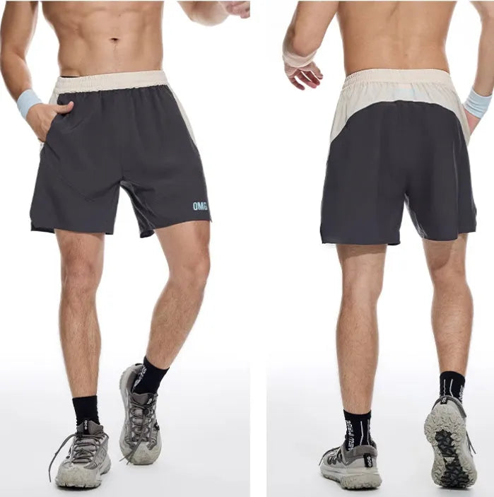 Man's loose grey workout shorts with elastic waist and white lace-up fly front.