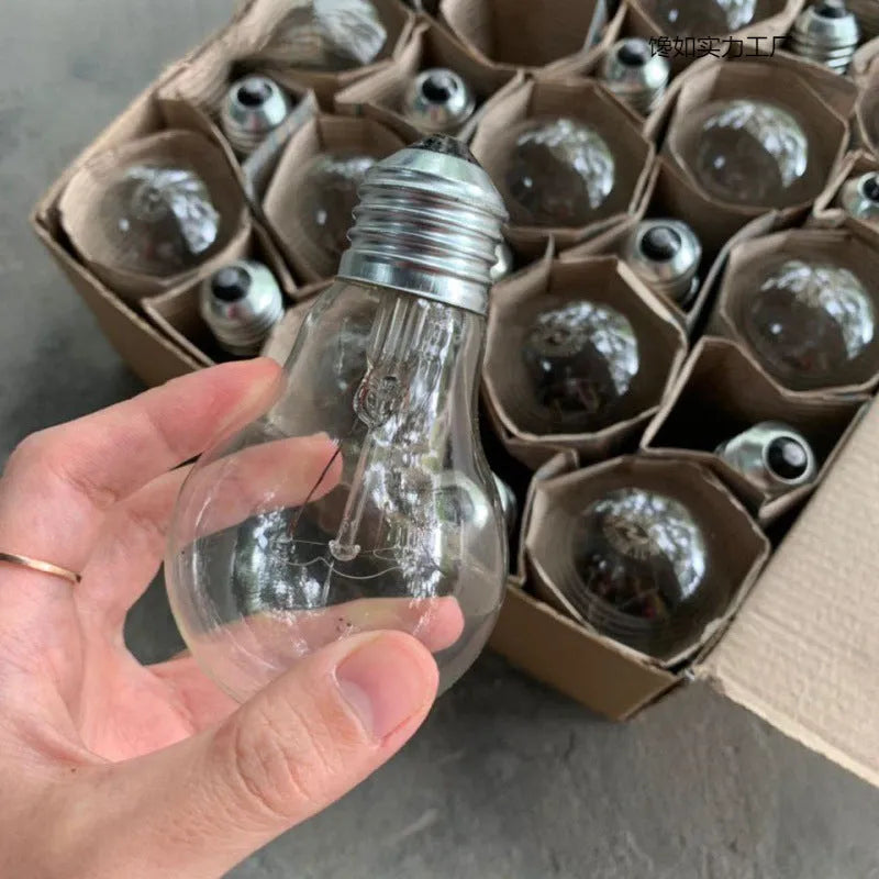 Tungsten incandescent household bulb with E27 screw base, clear glass, and visible filament