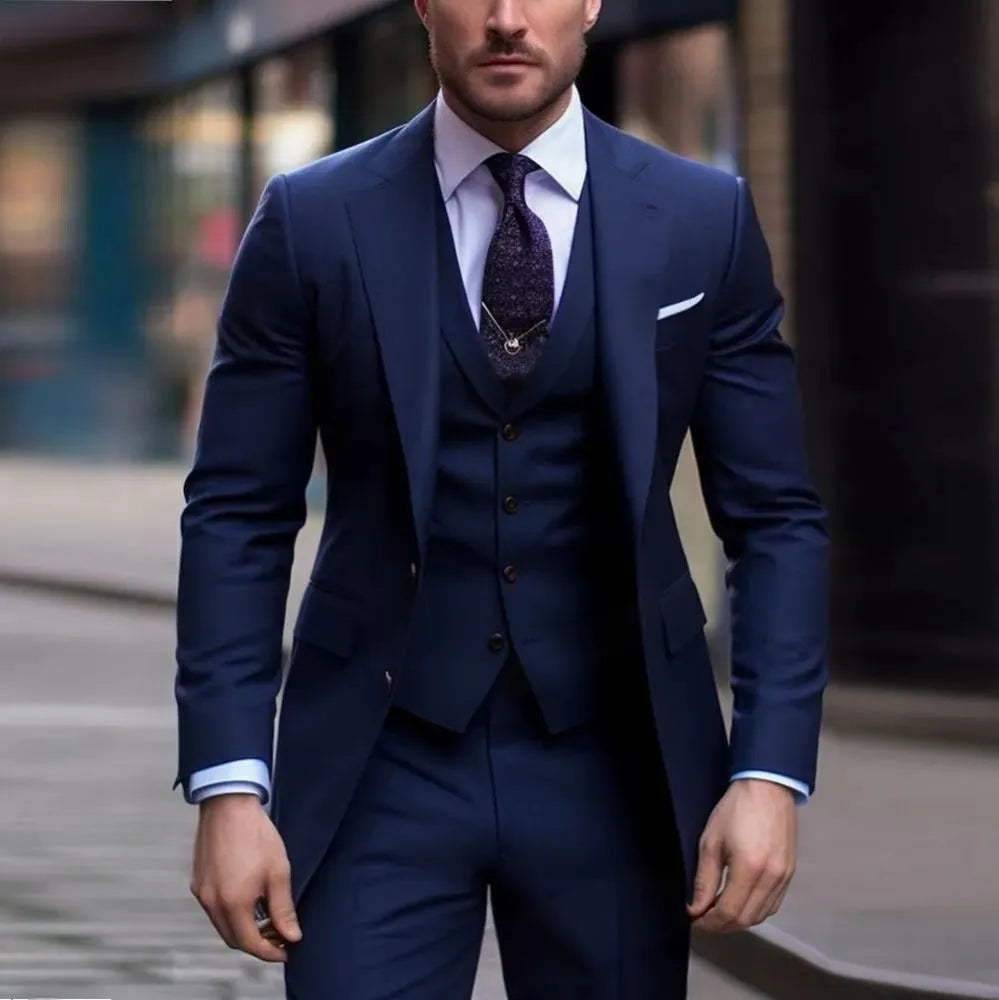 Men's three-piece slim fit business suit in a chemical fibre blend, showing coat, vest, and trousers.