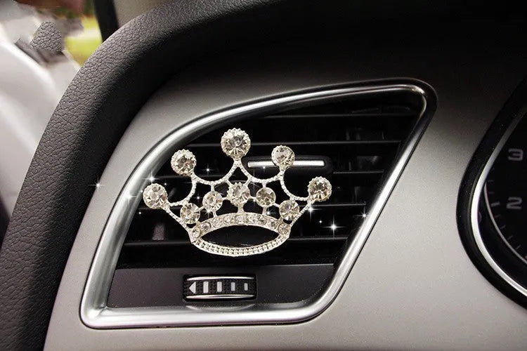 Alloy car perfume clip with liquid fruity scent attached to air vent in various cartoon styles