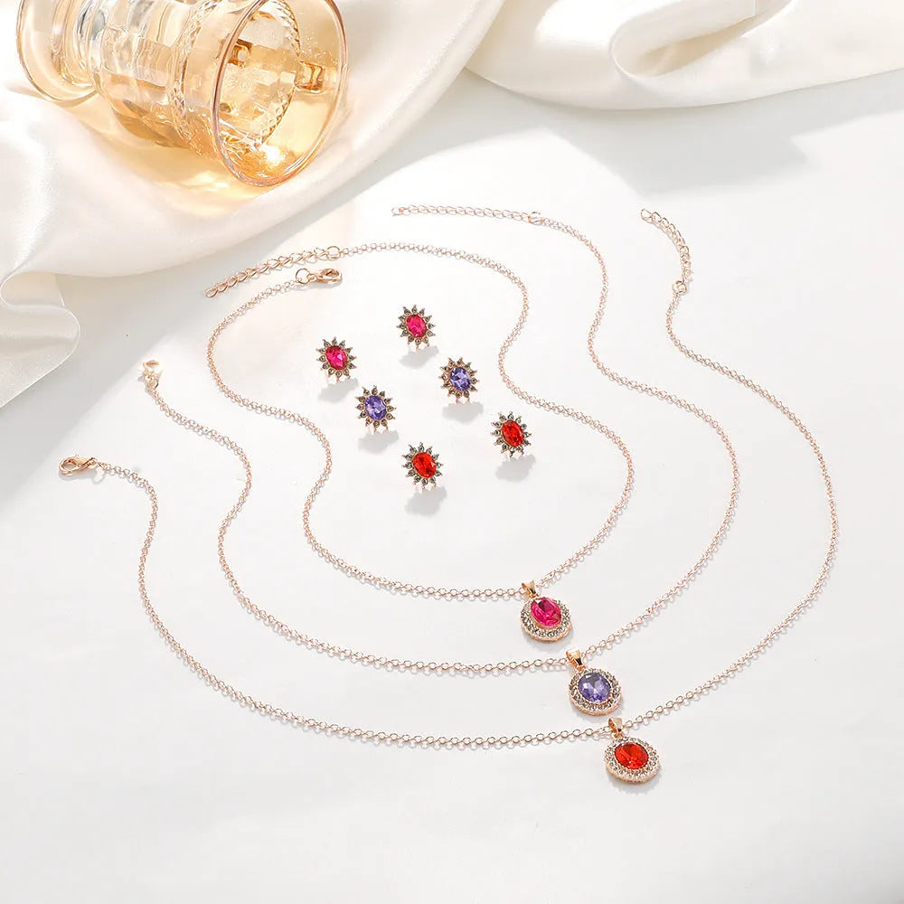 Rose gold sunflower earrings and necklace set for women on white background