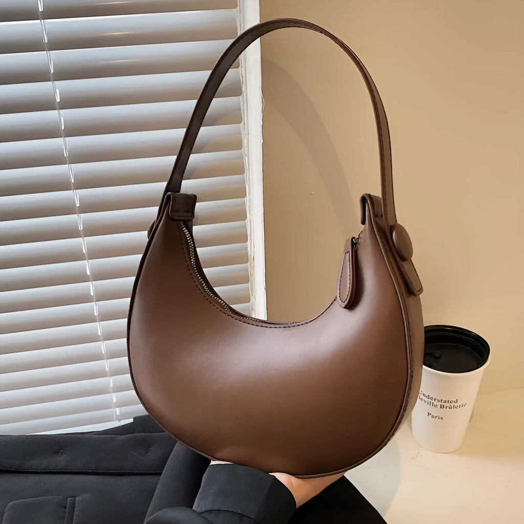 Retro dumpling shape shoulder bag in PU leather showing dimensions 21x20x6cm with zipper change bag interior