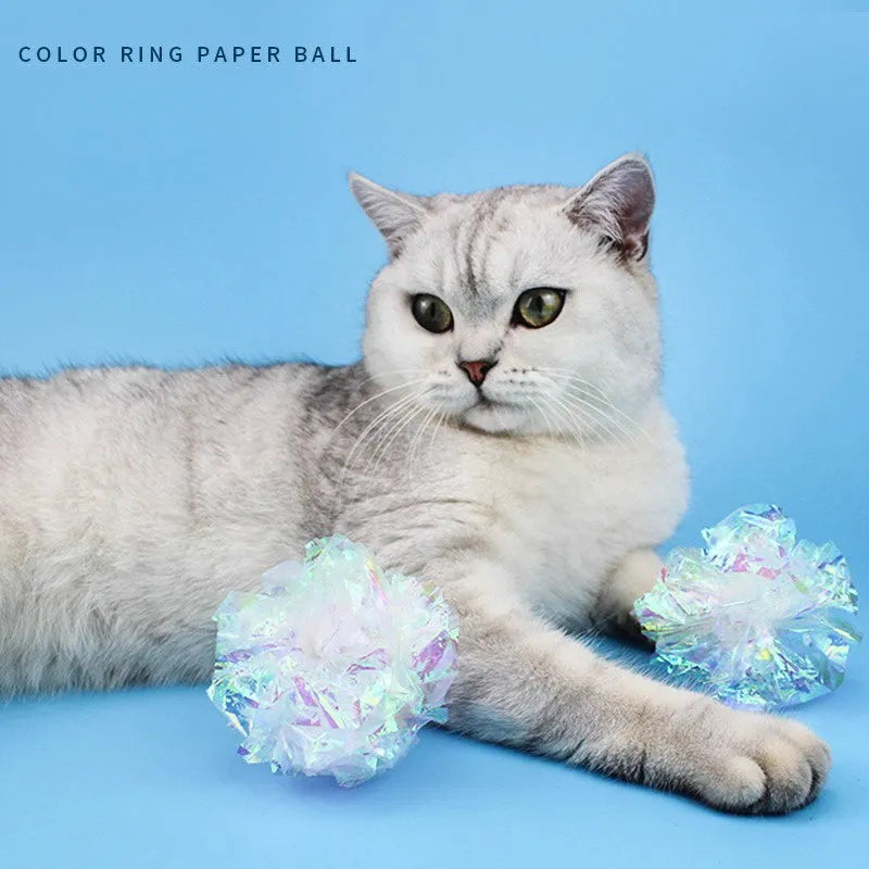 White noise-making paper ball cat toy on floor for indoor cat play