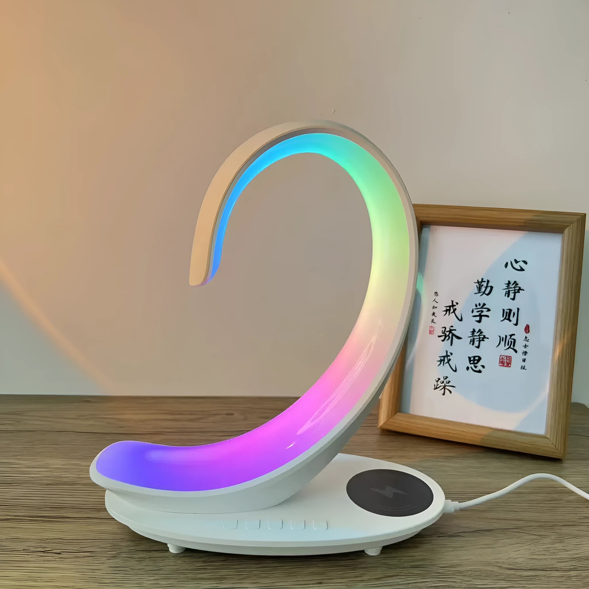 White swan shaped desktop wireless charger with Bluetooth speaker and colourful atmospheric lighting