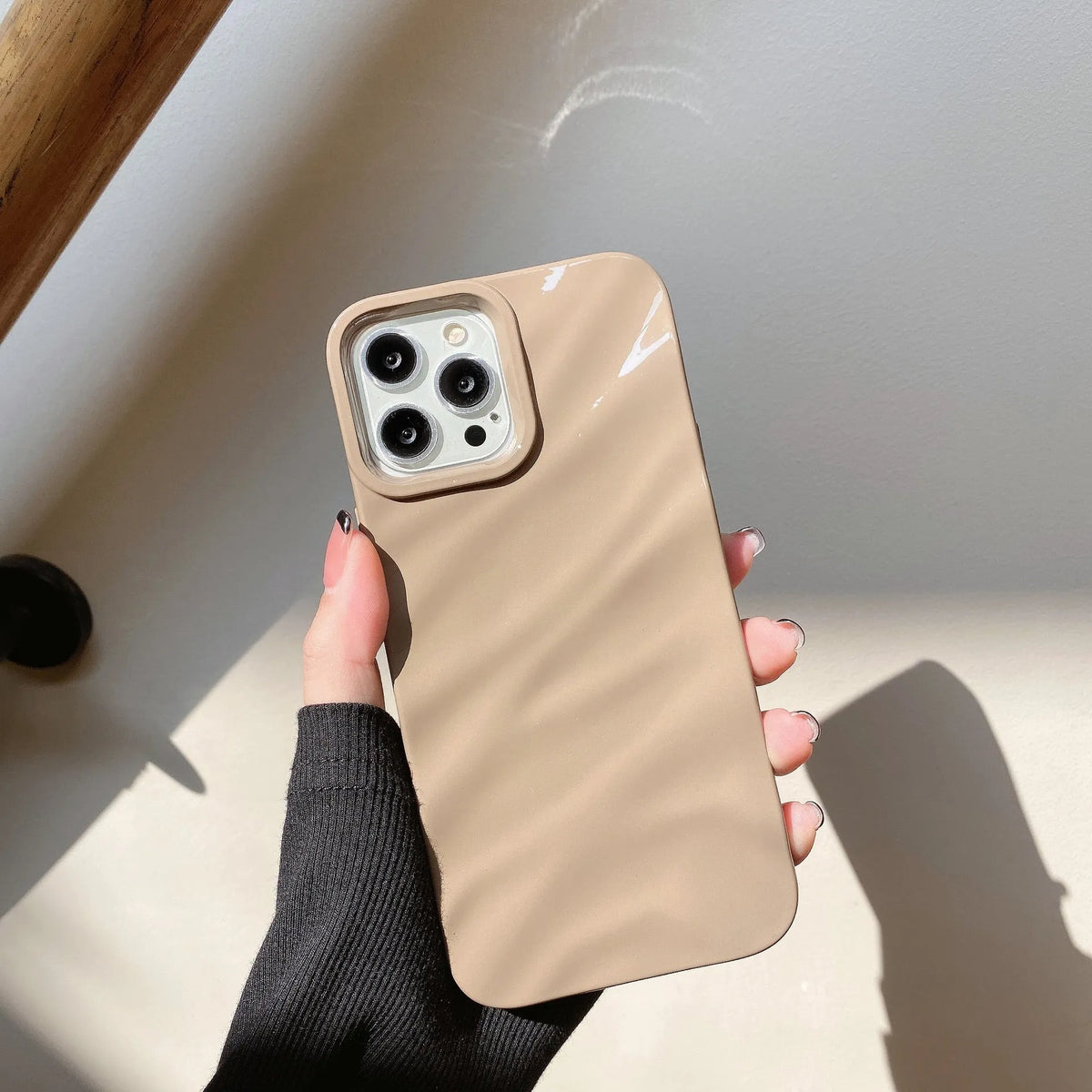 Soft solid colour wave pleated TPU protective case for Apple iPhone 17 series in burgundy on a white background.