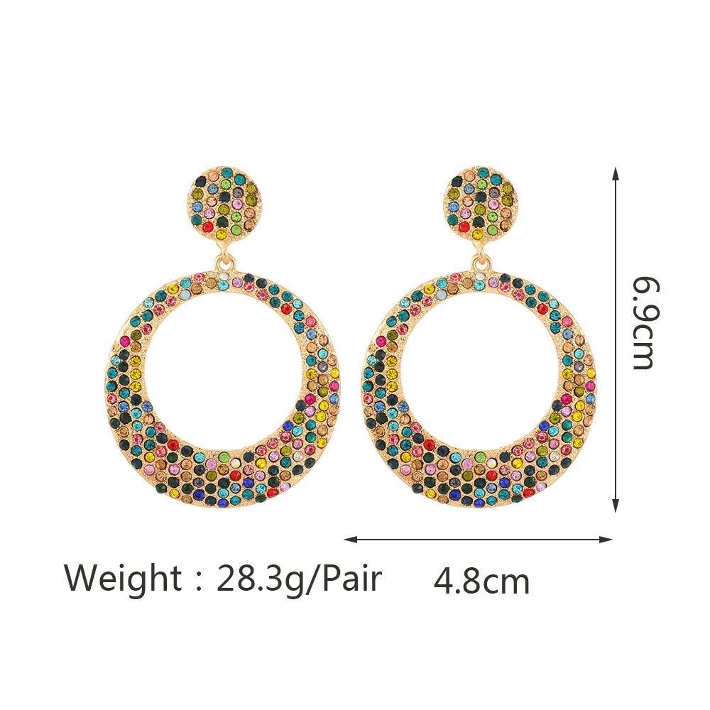 Colourful round pendant earrings with metal diamond detailing and cartoon style