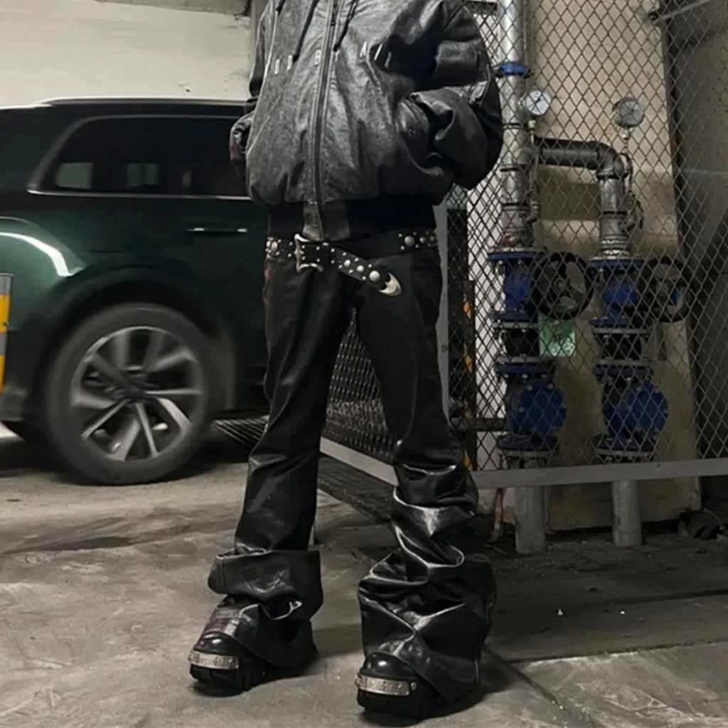 Black shiny patent leather coated straight-leg skinny jeans on a model
