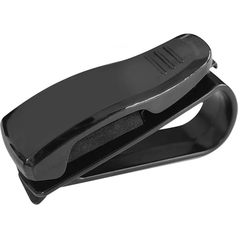 Black plastic clip for car sunshade to hold sunglasses and cards, dimensions 6.5 by 2.3 cm.