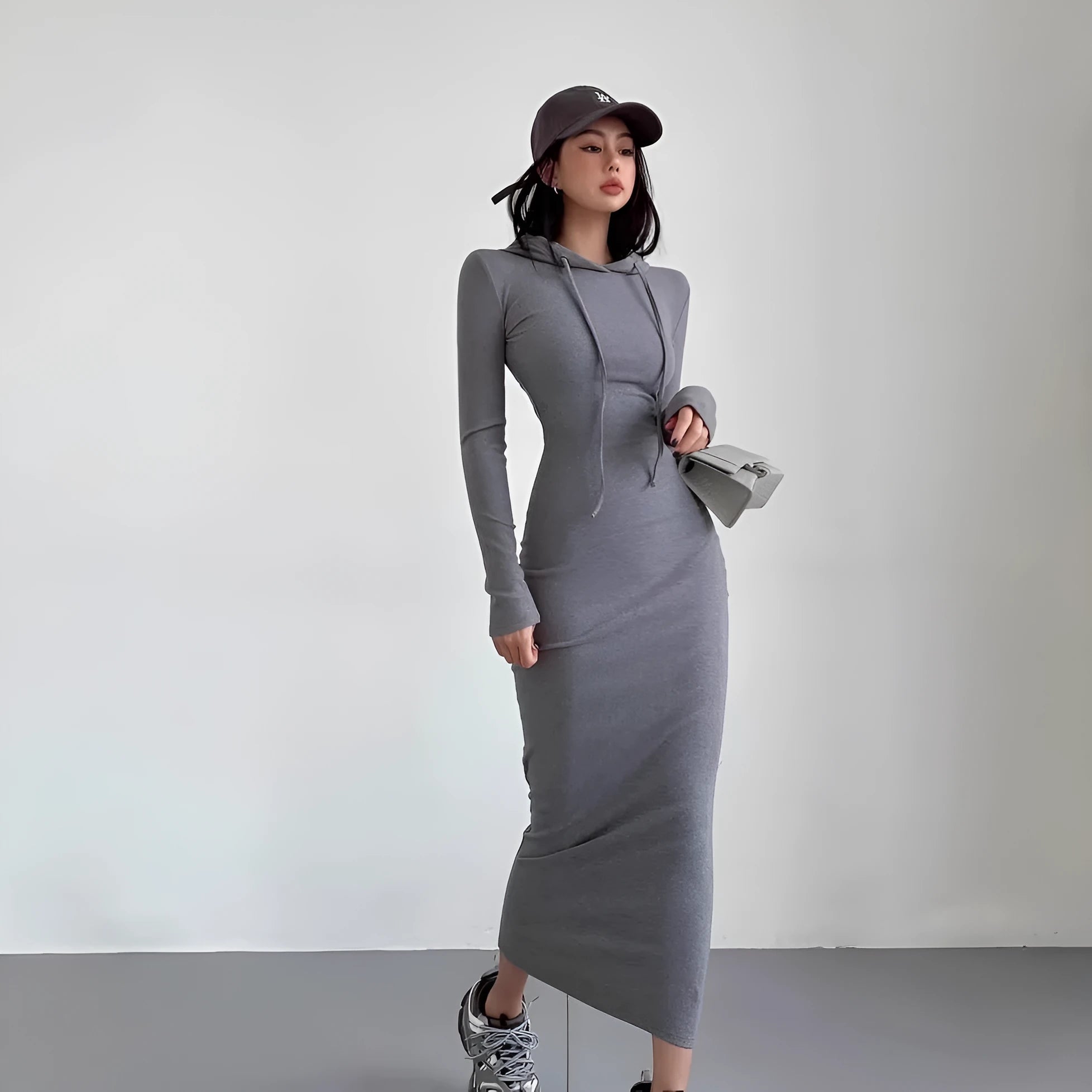 Women's grey hooded long sleeve sheath dress with high waist and over the knee length.