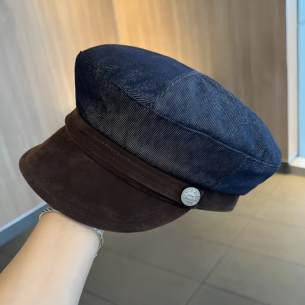 Dark blue denim adjustable octagonal newsboy cap shown on a neutral background.