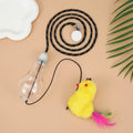 Interactive cat toy hanging on door frame with retractable rope, swinging attachments and treat reward bulb