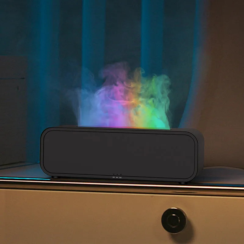 Black Flame Dynamic aroma diffuser with flickering light effect and remote control on a table.