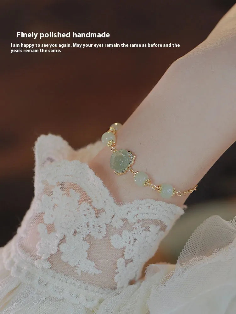 Women's bracelet with Hetian Jade Rose stone floral design and 14K gold gilding accents