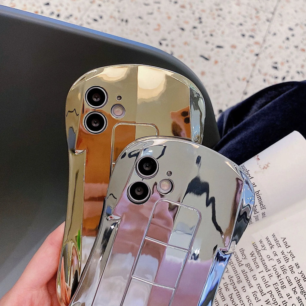 Sports car design TPU phone case in gold or silver for iPhone models, back cover style.