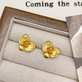 Retro flower earrings with gold or silver electroplated finishes and detailed petal design elements