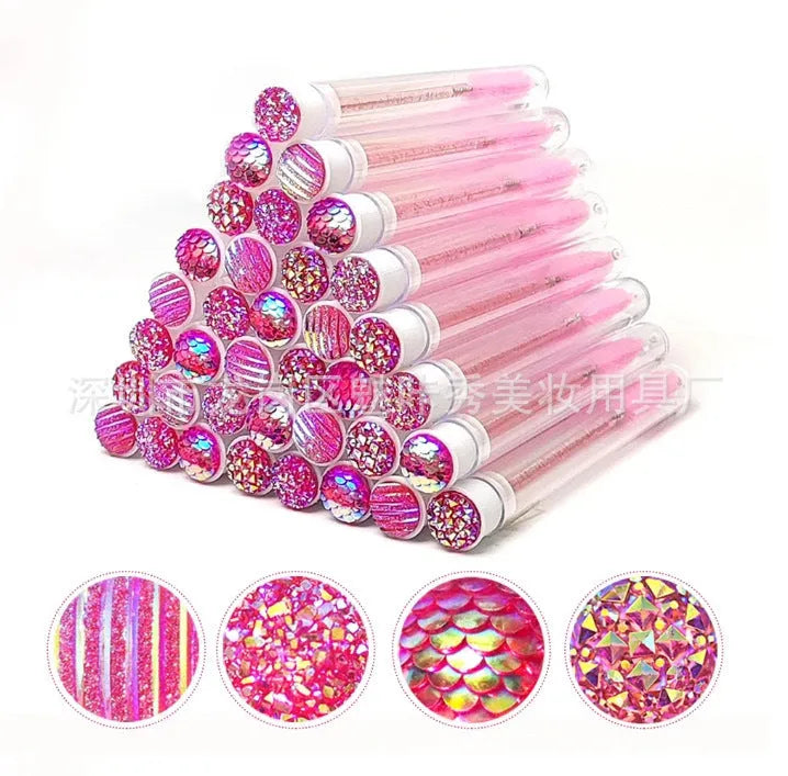 Set of coloured disposable eyelash brushes stored in clear plastic tubes