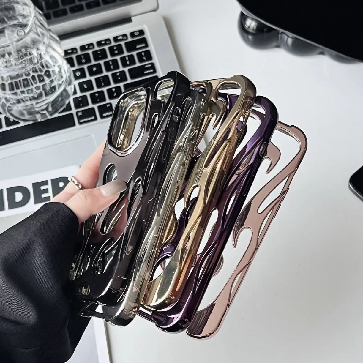 Electroplated hollow flame pattern soft phone case for Apple iPhone in silver finish.