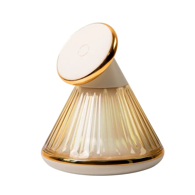 Champagne gold night table lamp with integrated magnetic wireless charging pad and dimmable LED light.